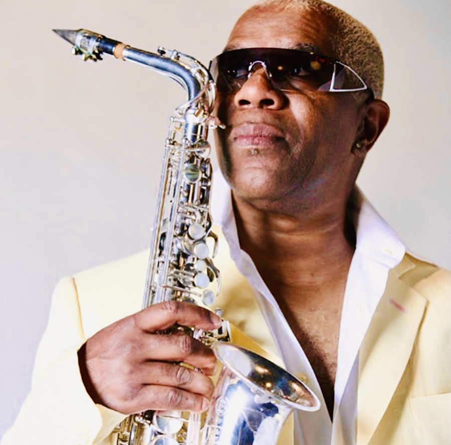 Dennis 'Dee Tee' Thomas portrait holding his saxophone