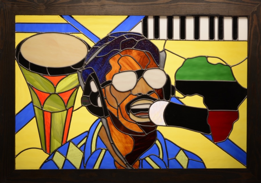 A stained-glass portrait of a musician