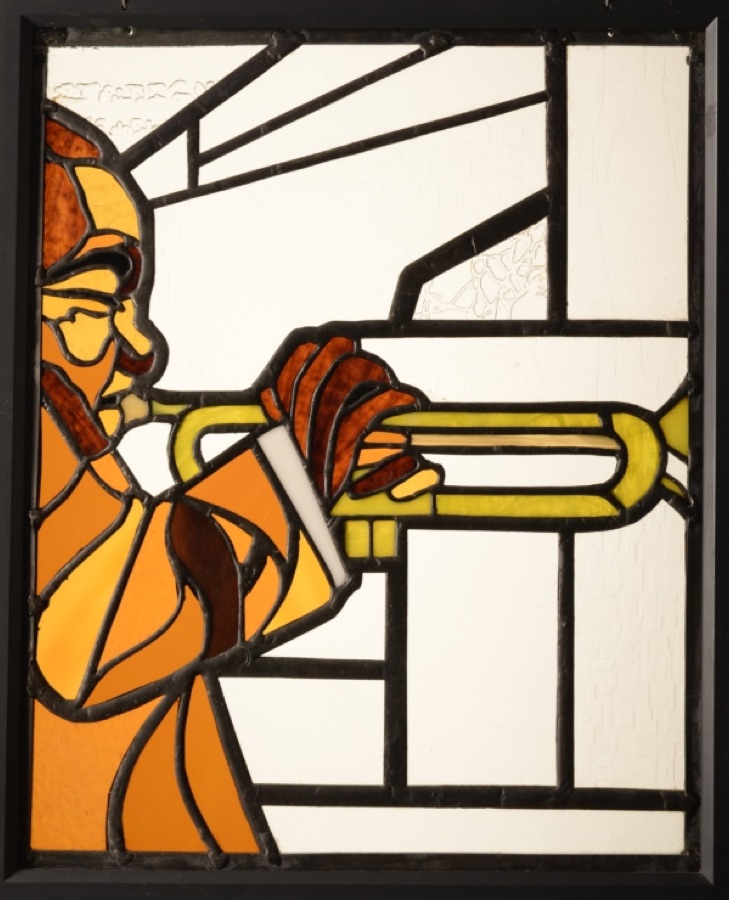 Stained glass — a trumpet player